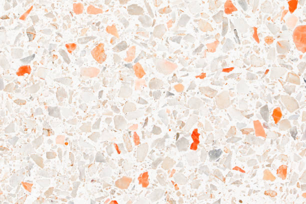 terrazzo flooring which has Orange rock Small or marble old. polished stone wall beautiful texture for background with copy space add text