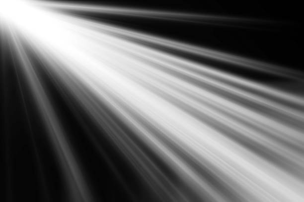 istock abstract beautiful beams of light, rays of light screen overlay on black background. 1060478616