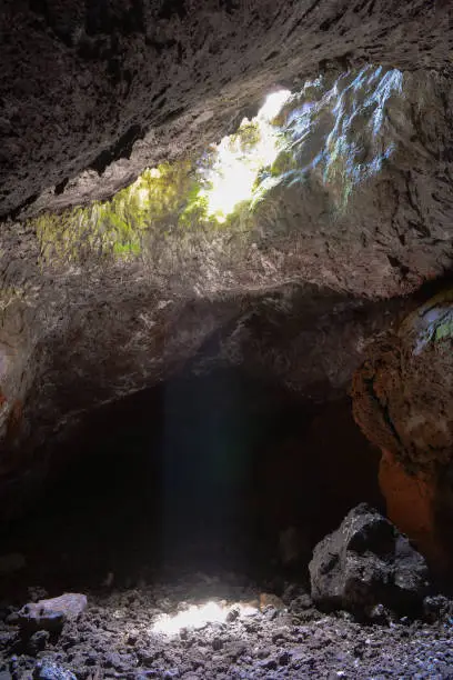 Light rays casting bright spots within a Lava tunnel