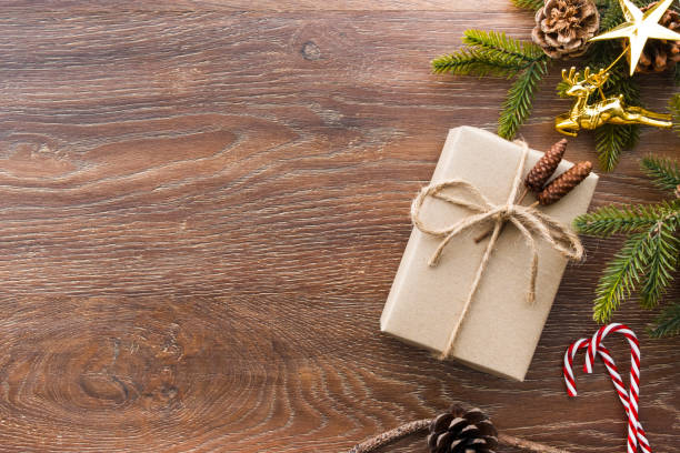 istock Christmas composition background on wood table with gift box and some decorations. Top view with copy space, flat lay. 1060488362