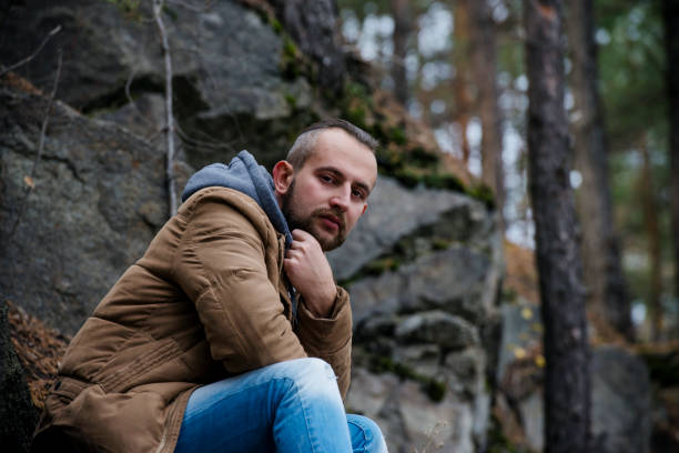 istock Handsome man hipster or guy with beard and moustache on serious face in hat and jacket 1060491430