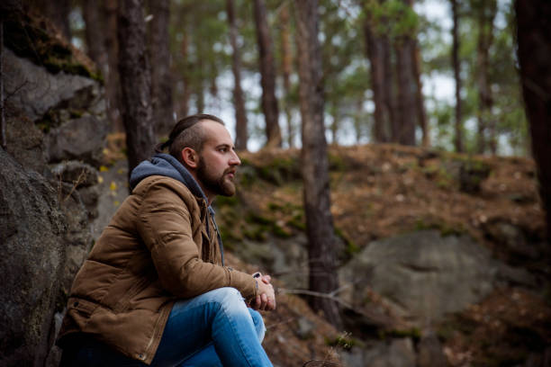 istock Handsome man hipster or guy with beard and moustache on serious face in hat and jacket 1060491454