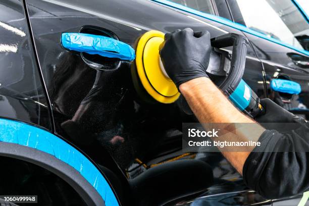 Car Polish Wax Worker Hands Applying Protective Tape Before Polishing Buffing And Polishing Car Car Detailing Man Holds A Polisher In The Hand And Polishes The Car Stock Photo - Download Image Now