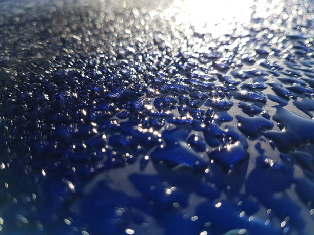 istock Frozen Water Droplets Melting in the Sunlight on a Car Roof 1060501784