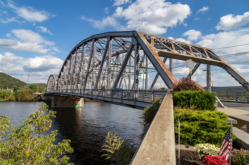 Matamoras, PA, USA - October 17, 2018:  The Mid-Delaware Bridge is a continuous truss bridge which carries U.S. Routes 6 and 209 across the river between the states of New York and Pennsylvania.
