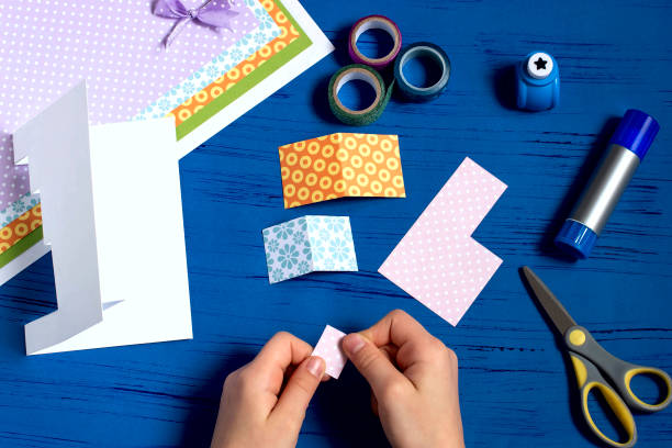 istock Child makes a card for Christmas. Step 6 1060507442