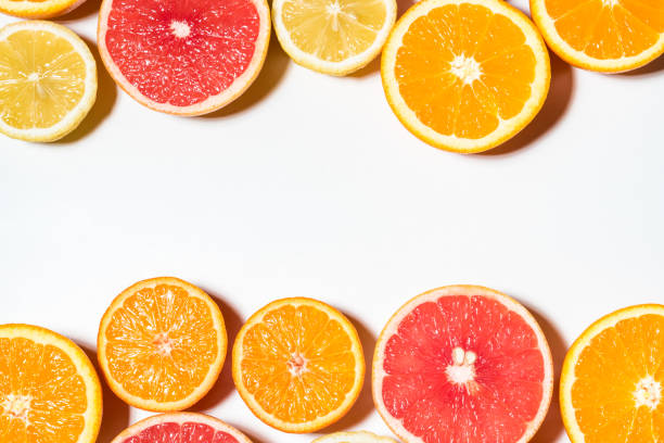 istock Assorted sliced fruits on white background.  Flat lay. Food vega 1060508180
