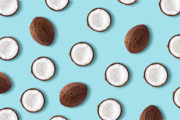istock Coconut fruit  on a pastel blue background. Minimal summer conce 1060508258