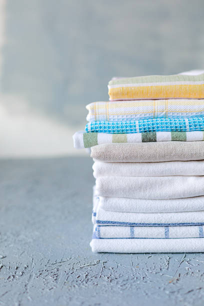 istock Pile of cotton kitchen napkins on grey background 1060510688