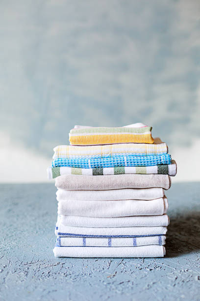 istock Pile of cotton kitchen napkins on grey background 1060510728