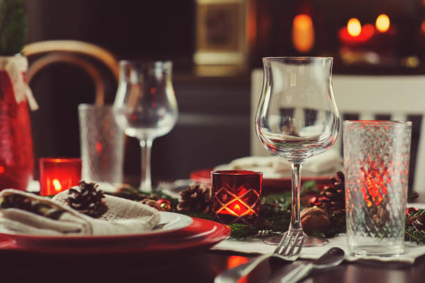 istock Table setting for celebration Christmas and New Year Holidays. Festive traditional red and green table at home with rustic details 1060512152