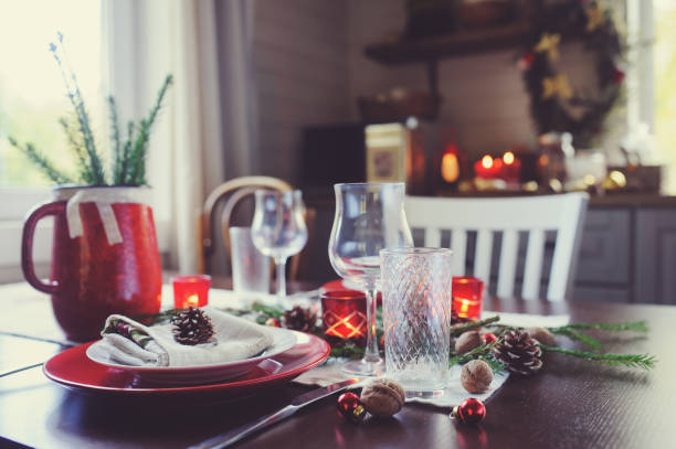 istock Table setting for celebration Christmas and New Year Holidays. Festive traditional red and green table at home with rustic details 1060512164