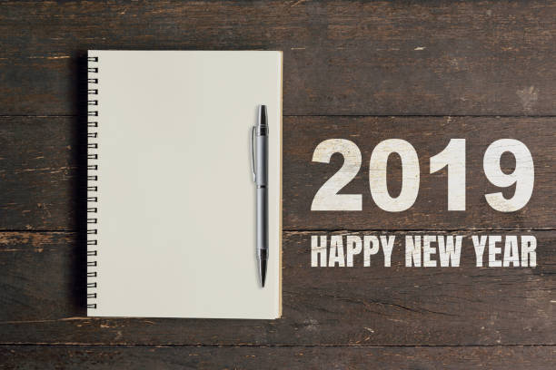 istock Numbers 2019 Happy New Year and notebook with pen for copy space. 1060514204