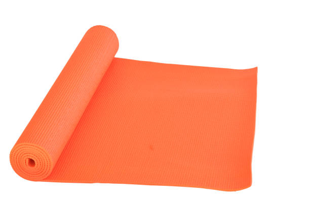 istock Orange mat for Yoga isolate on white background 1060515238
