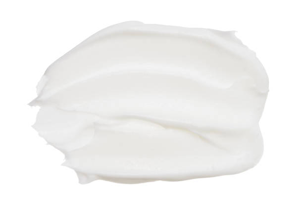 istock Cosmetic foundation close up cream isolated on white background 1060515394