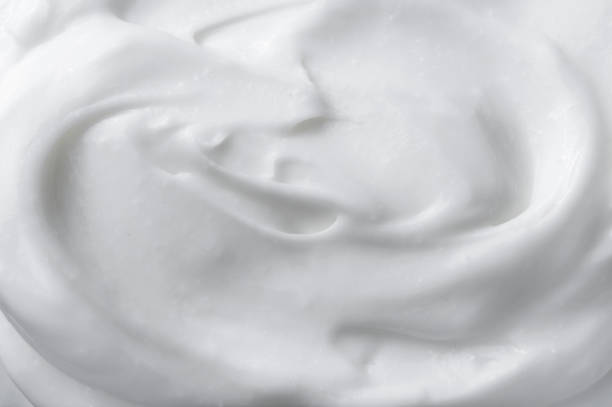 white texture of cosmetic body care cream background - creme chantilly imagens e fotografias de stock