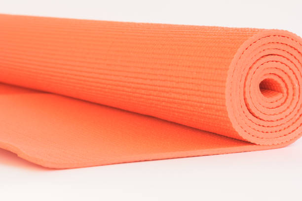 istock Macro Orange mat for Yoga isolate on white background 1060515434