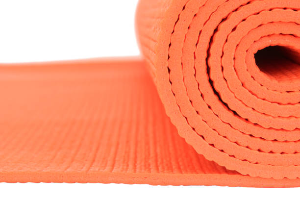 istock Macro Orange mat for Yoga isolate on white background 1060515632