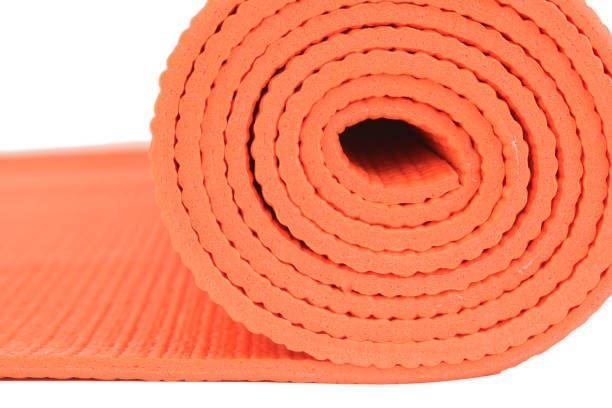 istock Macro Orange mat for Yoga isolate on white background 1060515712