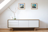 Modern sideboard in bright living room. Modern living, interior design. Scandinavian design.