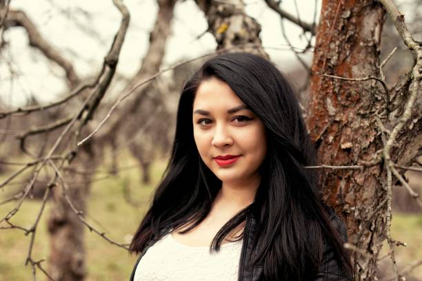 istock Plump girl on a cold spring walk 1060515994