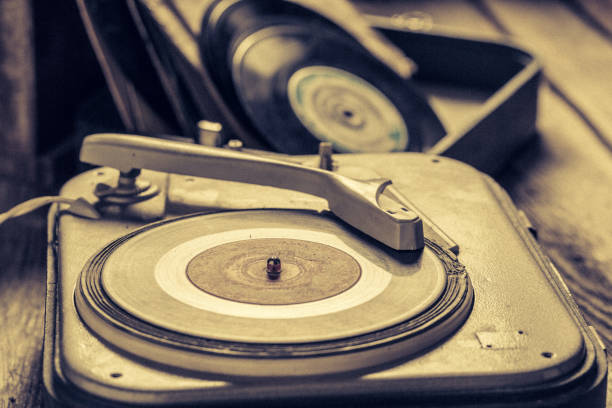 istock Retro gramophone with a stack of vinyl records 1060516148