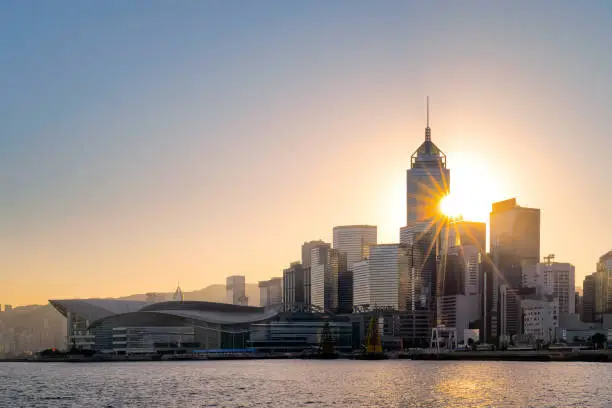 Photo of Hong Kong cityscape and barque in the evening over Victoria Harbour