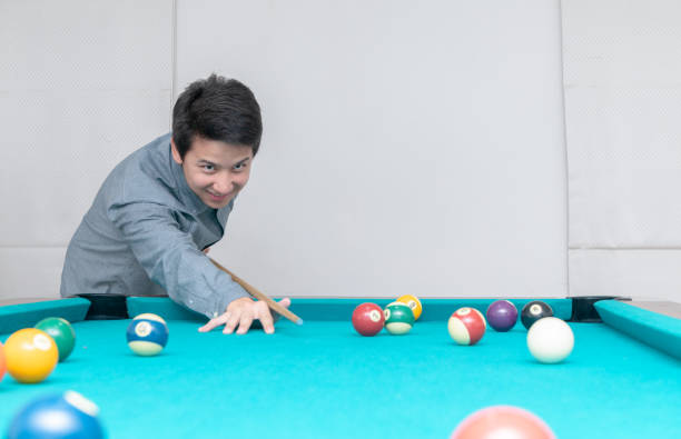 istock Asian man playing billards, sport and recreation 1060518038