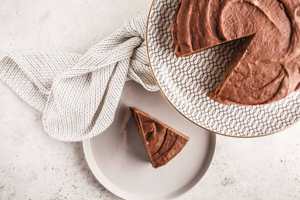 istock Vegan chocolate cake on a white dish for cake, top view, copy space. 1060518070