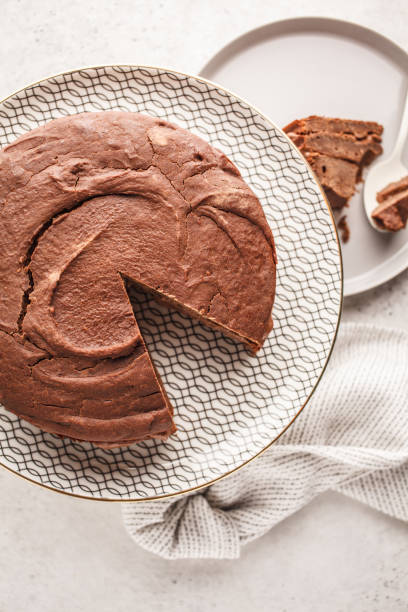 istock Vegan chocolate cake on a white dish for cake, top view, copy space. 1060518138