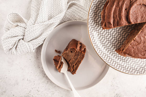 istock Vegan chocolate cake on a white dish for cake, top view, copy space. 1060518184