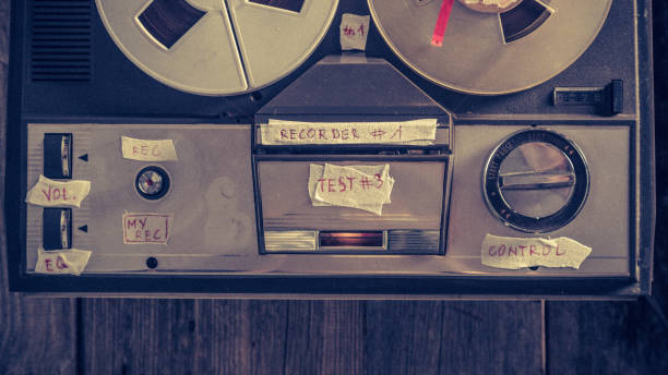 istock Old reel audio recorder with microphone and roll of tape 1060519202