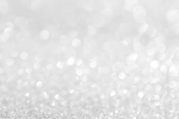 istock abstract background white Silver lights on christmas bokeh 1060519530