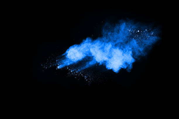 istock abstract blue powder splatted background,Freeze motion of color powder exploding/throwing color powder,color glitter texture on black background. 1060519850