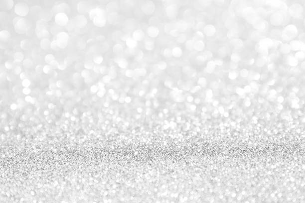 istock abstract background white Silver lights on christmas bokeh 1060521872