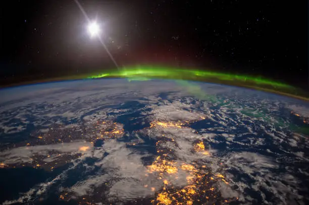 Photo of Ireland, United Kingdom and Scandinavia on a moonlit night under an amazing aurora.