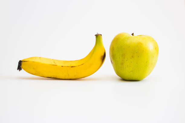 Breakfast or healthy meal. A green apple, a banana and a kiwi