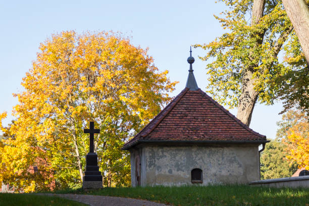 istock small house next to a church 1060525044