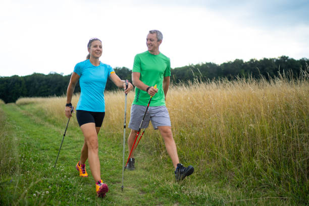 istock personal nordic walking instructor with female customer 1060528482