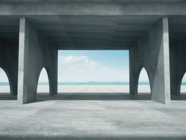 Photo of Concrete corridor,Abstract structure,Product showcase background with The sea background.