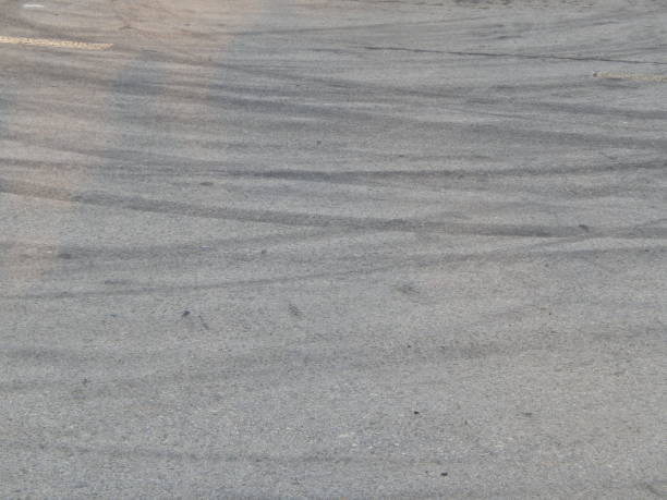 istock Car tire stains on asphalt racing cards 1060535024