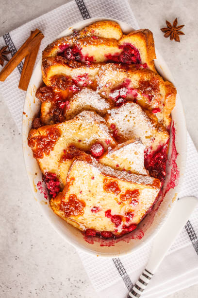 istock French toast casserole with raspberries, powdered sugar and cinnamon. 1060536614