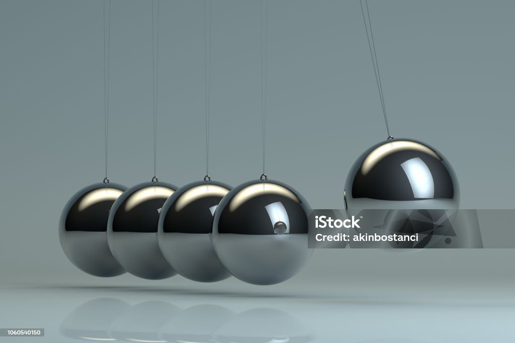 Newton's Cradle, Balancing Balls Newton's Cradle, shiny, metallic balancing balls, pendulum. Pendulum Stock Photo