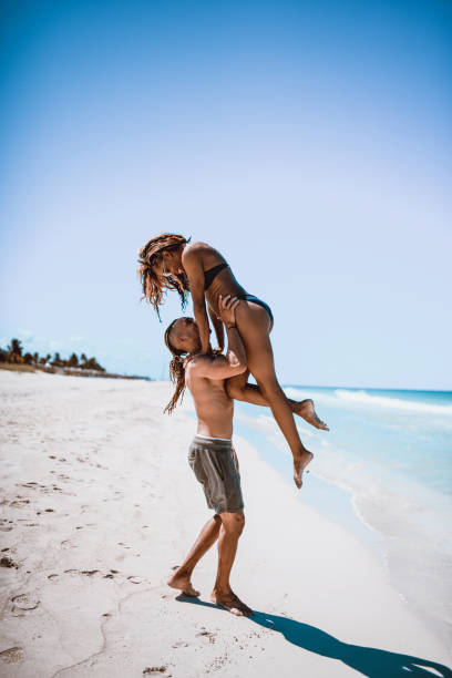 istock Young Latin Couple Having Fun On Empty Cuban Beach 1060540810