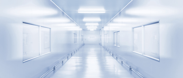 modern interior science laboratory or factory walkway background with fluorescent lighting in monotone