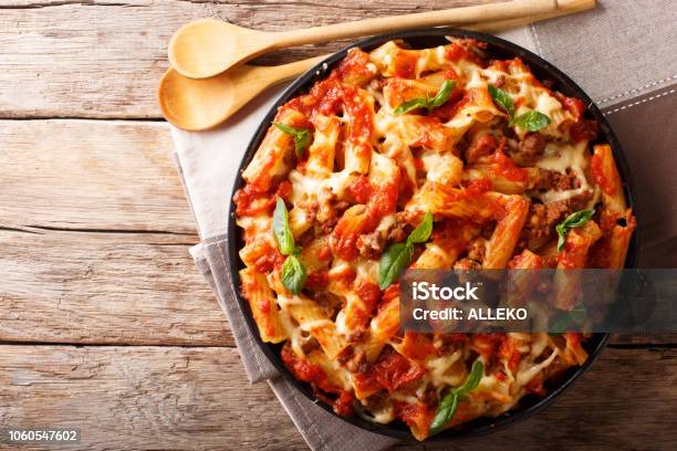 Pasta Ziti With Bolognese Sauce And Cheese Closeup Horizontal Top View Rustic Style Stock Photo - Download Image Now