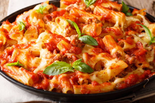 istock Delicious pasta with ground beef, tomatoes and cheese close-up. horizontal 1060547776