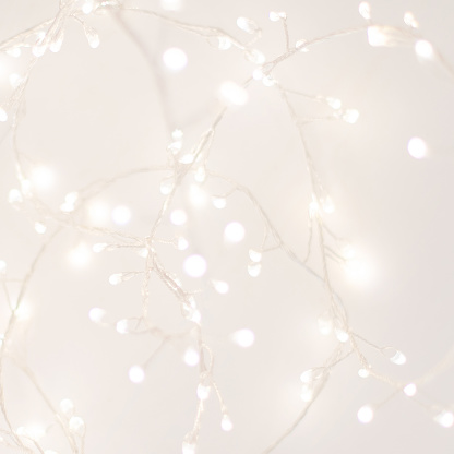 Abstract Silver Christmas Winter Background with festive glowing bokeh lights, copyspace