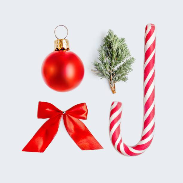 istock Christmas decorations for mock up template design with red ball, fir tree branch and candy stick. Top view. Flat lay 1060554844