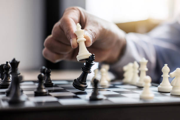 istock Businessman's hand playing chess game to development analysis new strategy plan, business strategy leader and teamwork concept for win and success 1060555270